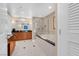 Bright bathroom featuring double vanities, a soaking tub and separate shower with modern tile work at 135 E Harmon Ave # 701, Las Vegas, NV 89109