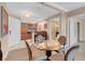 An eat-in dining area with a glass top table and a glimpse into the modern kitchen at 135 E Harmon Ave # 701, Las Vegas, NV 89109