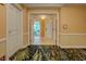 Hallway entrance with decorated carpet, trim and doorway to suite at 135 E Harmon Ave # 701, Las Vegas, NV 89109