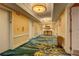 Hallway with suites, elevators, console table and carpet at 135 E Harmon Ave # 701, Las Vegas, NV 89109