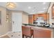 Modern kitchen with dark countertop and seating at a bar at 135 E Harmon Ave # 701, Las Vegas, NV 89109