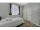 Bright bedroom features a single bed, a closet, and wood-look flooring at 1421 Hometown Ave, Henderson, NV 89074