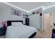 Bedroom featuring white bedding, wood-look floors, and closet at 1421 Hometown Ave, Henderson, NV 89074