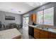 A combined kitchen and dining area with backyard access via sliding glass doors at 1421 Hometown Ave, Henderson, NV 89074