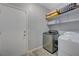 This laundry room is equipped with a washing machine and dryer at 1421 Hometown Ave, Henderson, NV 89074