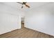 Clean bedroom featuring wood-look floors, ample closet space, and neutral decor, providing a comfortable and inviting space at 1426 Clipperton Ave, Henderson, NV 89074