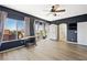 Stylish bedroom showcasing dark walls, wood-look floors, and bright windows, providing a tranquil atmosphere at 1426 Clipperton Ave, Henderson, NV 89074