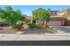 Charming two-story home featuring a well-maintained front yard at 1426 Clipperton Ave, Henderson, NV 89074