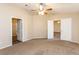 Spacious bedroom with carpet, closet, and multiple doors at 144 La Mirada Dr, Henderson, NV 89015