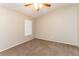 Cozy bedroom with neutral carpet and a ceiling fan with light fixture at 144 La Mirada Dr, Henderson, NV 89015