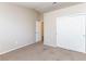 Carpeted bedroom offering a closet and entry door at 144 La Mirada Dr, Henderson, NV 89015