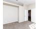 Carpeted bedroom featuring a closet and entry door at 144 La Mirada Dr, Henderson, NV 89015