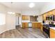 Bright kitchen featuring stainless steel appliances and wood-look flooring at 144 La Mirada Dr, Henderson, NV 89015