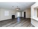 Spacious living room with luxury vinyl plank flooring, fireplace and ceiling fan at 144 La Mirada Dr, Henderson, NV 89015