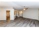 Spacious living room with luxury vinyl plank flooring, and easy access to kitchen and dining areas at 144 La Mirada Dr, Henderson, NV 89015