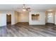 Spacious living room with luxury vinyl plank flooring and open access to other rooms at 144 La Mirada Dr, Henderson, NV 89015