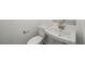 Powder room featuring white fixtures, pedestal sink, and modern faucet at 1479 Melodic Lark Dr, Las Vegas, NV 89138