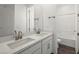 Bathroom featuring dual sinks, white cabinets, with tiled tub and shower combo at 1479 Melodic Lark Dr, Las Vegas, NV 89138