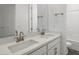 Bathroom featuring a dual sink vanity, quartz countertop, and modern faucets at 1479 Melodic Lark Dr, Las Vegas, NV 89138