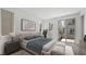 Modern bedroom features a plush king bed, neutral decor, and sliding door access to a private balcony at 1479 Melodic Lark Dr, Las Vegas, NV 89138