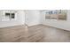 Open-concept space featuring hardwood floors, base molding and multiple windows for great natural light at 1479 Melodic Lark Dr, Las Vegas, NV 89138