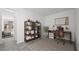 Home office featuring neutral walls, wood desk, rolling chair, and wood shelving at 1479 Melodic Lark Dr, Las Vegas, NV 89138