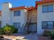 Condos feature desert landscaping, two-story units, stairs to the upper floor and stylish architectural detail at 1701 E Katie Ave # 42, Las Vegas, NV 89119