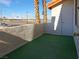 This condo has a lovely green turf patio with a walled balcony, with access to a storage closet at 1701 E Katie Ave # 42, Las Vegas, NV 89119