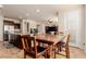 Open dining area featuring wood table and chairs, connecting to kitchen and living spaces at 2149 Morro Vista Dr, Las Vegas, NV 89135