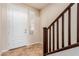 Bright foyer featuring tile flooring, a wooden staircase, and a stylish front door with natural light at 2149 Morro Vista Dr, Las Vegas, NV 89135