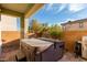 Covered patio with a hot tub and built-in grill at 2149 Morro Vista Dr, Las Vegas, NV 89135