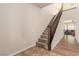 Elegant staircase with carpeted steps and wooden banister, leading to a spacious living area at 2149 Morro Vista Dr, Las Vegas, NV 89135