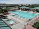 Aerial view of a large community pool with hot tub and lounging areas at 2201 Tiger Links Dr, Henderson, NV 89012