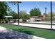 Well-maintained outdoor bocce ball court with lush greenery, shelters, and shaded seating at 2201 Tiger Links Dr, Henderson, NV 89012