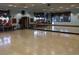 Bright dance studio with hardwood floors, mirrored wall, and equipment storage, perfect for fitness activities at 2201 Tiger Links Dr, Henderson, NV 89012