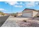 Street view featuring charming single-story home with a two-car garage, desert landscaping, and a long paved driveway at 2201 Tiger Links Dr, Henderson, NV 89012