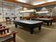 Spacious game room featuring two billiard tables, classic lighting, and comfortable seating at 2201 Tiger Links Dr, Henderson, NV 89012