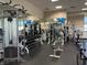 Brightly lit gym with a variety of modern exercise equipment and floor-to-ceiling mirrors at 2201 Tiger Links Dr, Henderson, NV 89012