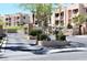 Community entrance with gated access, desert landscaping, and multi-story residential buildings at 2240 Highpointe Dr # 201, Laughlin, NV 89029