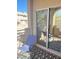 A cozy patio with a blue chair and decorative black-and-white rug at 2240 Highpointe Dr # 201, Laughlin, NV 89029