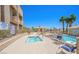 Inviting pool and jacuzzi area with lounge chairs in a well-maintained community at 2240 Highpointe Dr # 201, Laughlin, NV 89029