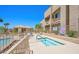 Community pool and jacuzzi area with lounge chairs offer a resort-style experience at 2240 Highpointe Dr # 201, Laughlin, NV 89029