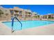 Large community pool area featuring ample lounge seating and a sparkling blue pool at 2240 Highpointe Dr # 201, Laughlin, NV 89029