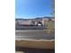 View of neighborhood street and adjacent buildings and wall at 2240 Highpointe Dr # 201, Laughlin, NV 89029