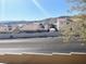 A street view of a quiet neighborhood with tile-roofed homes at 2240 Highpointe Dr # 201, Laughlin, NV 89029