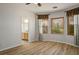 Bedroom leading to ensuite bathroom with natural light and wood-look floors at 2629 Chateau Clermont St, Henderson, NV 89044