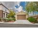 Beautiful single-Gathering home featuring a well-maintained front yard and an attached two-car garage at 2629 Chateau Clermont St, Henderson, NV 89044