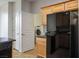 Kitchen area featuring modern black refrigerator and access to laundry area at 2629 Chateau Clermont St, Henderson, NV 89044