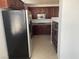 View of kitchen with stainless steel appliances and dark brown cabinetry at 27 E Agate Ave # 303, Las Vegas, NV 89123