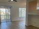 Open living area with lots of natural light and sliding door leading to a balcony at 27 E Agate Ave # 303, Las Vegas, NV 89123